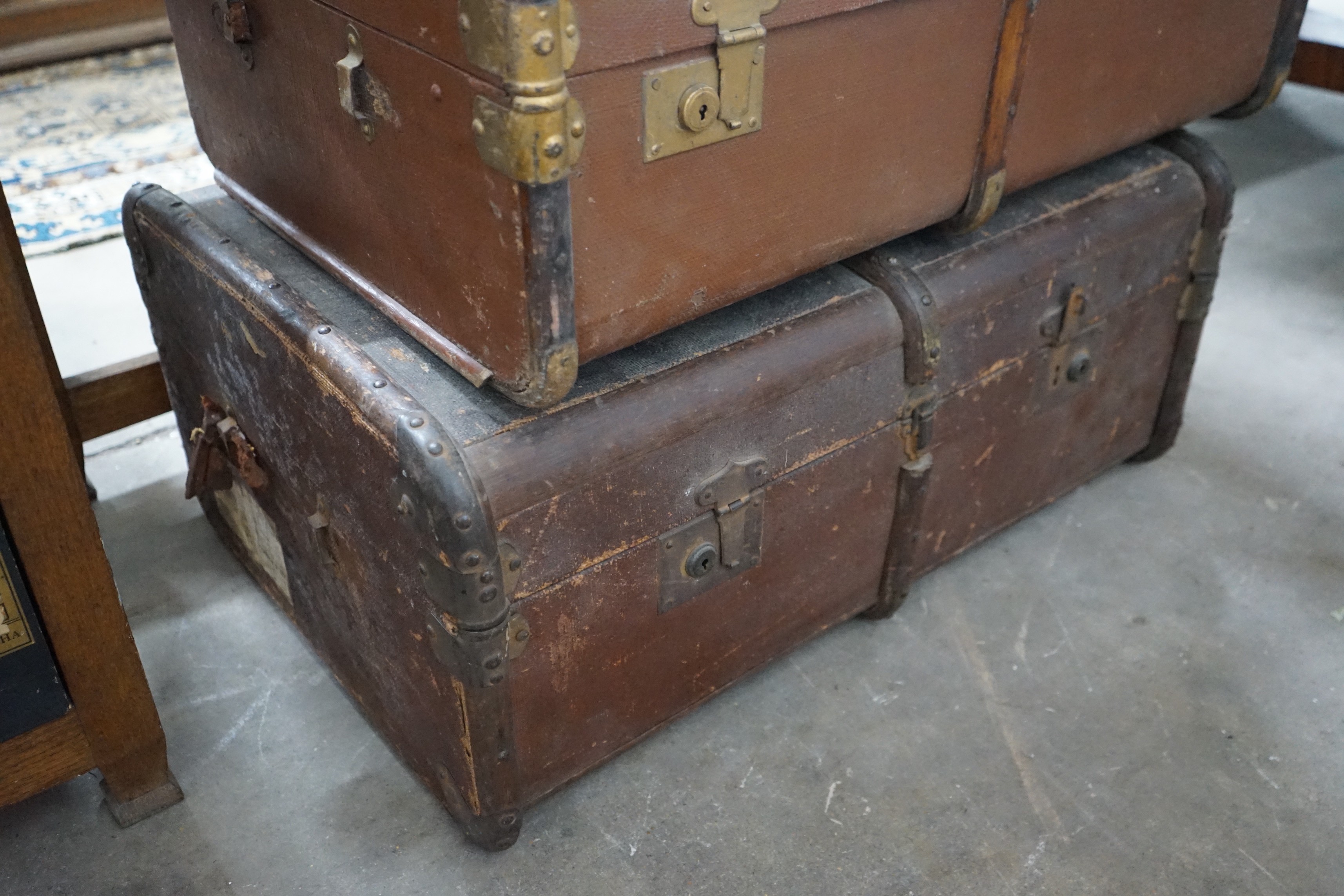 Three vintage suitcases, largest width 75cm